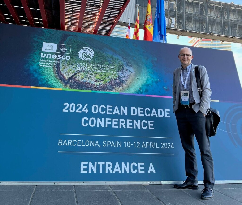 CEO Darren Kindleysidesat the entrance of the Ocean Decade Conference